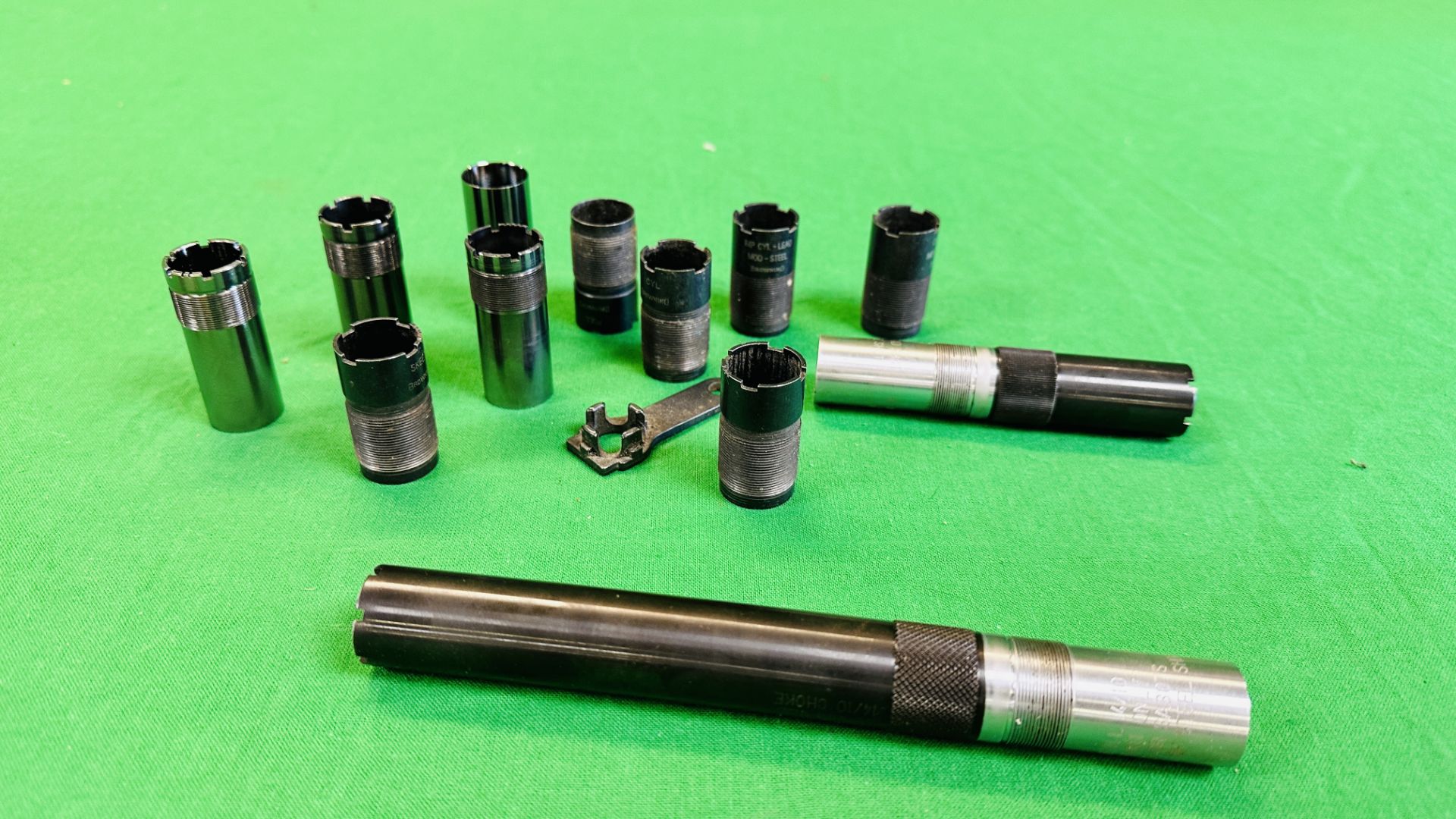 A COLLECTION OF 12 VARIOUS CHOKES TO INCLUDE BROWNING.