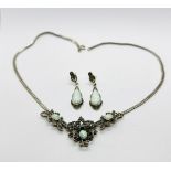 AN ELABORATE SIILVER MATCHING NECKLACE AND EARRING SET, INSET WITH MARCASITE AND OPALS.