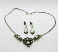 AN ELABORATE SIILVER MATCHING NECKLACE AND EARRING SET, INSET WITH MARCASITE AND OPALS.