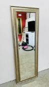 AN ANTIQUED FINISH BEVELLED DRESSING MIRROR W 45CM H 129CM.