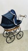 A REPRODUCTION WICKER AND METAL CRAFT DOLL'S PRAM.