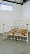 A TRADITIONAL DOUBLE METAL BEDSTEAD FINISHED IN CREAM.