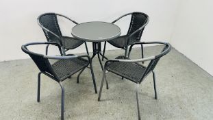 MODERN GLASS TOP CIRCULAR GARDEN TABLE AND 4 METAL FRAMED CHAIRS.