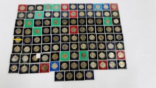 APPROXIMATELY 100 CASED, COMMEMORATIVE CROWNS 1965-1981 (IN FILE BOX).
