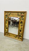 WALL MIRROR IN GILT AND FLORAL DECORATED FRAMEWORK - W 94CM H 74CM.