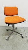 A MID CENTURY LABOFA SWIVEL OFFICE CHAIR UPHOLSTERED IN ORANGE.