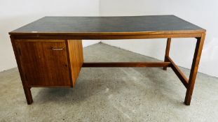 MID CENTURY TEAK FRAMED OFFICE DESK WITH BLACK INSET TOP AND SINGLE CUPBOARD.