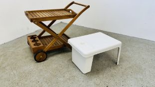 A TEAK WOOD GARDEN TROLLEY CART ALONG WITH A WHITE UPVC GARDEN TABLE WITH ICE BOX.