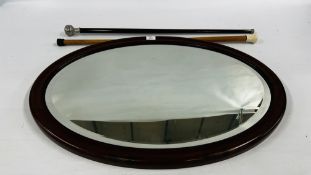 AN ANTIQUE MAHOGANY FRAMED MIRROR WITH BEVELLED GLASS PLATE,