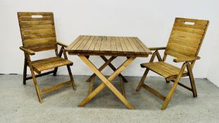 A SQUARE HARDWOOD FOLDING SLATTED GARDEN TABLE ALONG WITH A PAIR OF MATCHING CHAIRS.