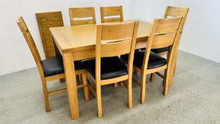 A MODERN GOOD QUALITY OAK EXTENDING DINING TABLE COMPLETE WITH A SET OF 6 MATCHING OAK DINING