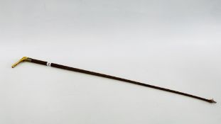 A VINTAGE LEATHER BOUND RIDING CROP WITH UNUSUAL BAND OF A HORSE (NO MARKS VISIBLE).