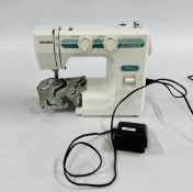 JANOME DMX200 SEWING MACHINE AND FOOT PEDAL - SOLD AS SEEN.