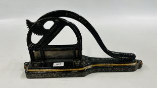 A VINTAGE CAST IRON TOBACCO PLUG CUTTER MARKED "P.J.