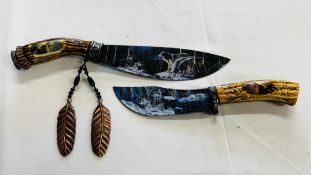 TWO DECORATIVE HORN HANDLE STYLE HUNTING KNIVES THE BLADE DEPICTING WOLVES - NO POSTAGE OR PACKING.