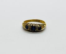 AN ANTIQUE 18CT GOLD DIAMOND AND SAPPHIRE GYPSY RING.