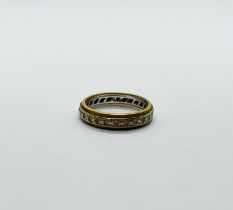 AN 18CT GOLD STONE SET ETERNITY RING.