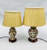 TWO DECORATIVE FLORAL DESIGNER TABLE LAMPS OF SIMILAR DESIGN ON WOODEN STANDS (ONE HAVING NO PLUG)