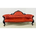 A VICTORIAN MAHOGANY FRAMED HUMP BACK SOFA IN RED BUTTON BACK VELOUR - L 210CM.