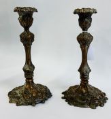 A PAIR OF ORNATE C19TH COPPER CANDLESTICKS WITH DETACHABLE SCONCES - HEIGHT 27CM.