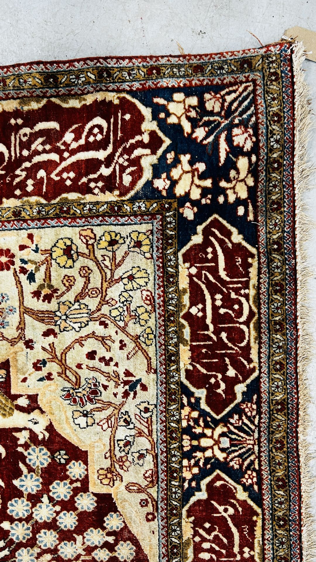 A PERSIAN DESIGN RUG DECORATED WITH SPRAYS OF FLOWERS AND DEER AND ARABIC INSCRIPTIONS, - Image 9 of 32