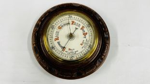 A MAHOGANY MOUNTED ANAROID BAROMETER - DIAMETER 22CM.