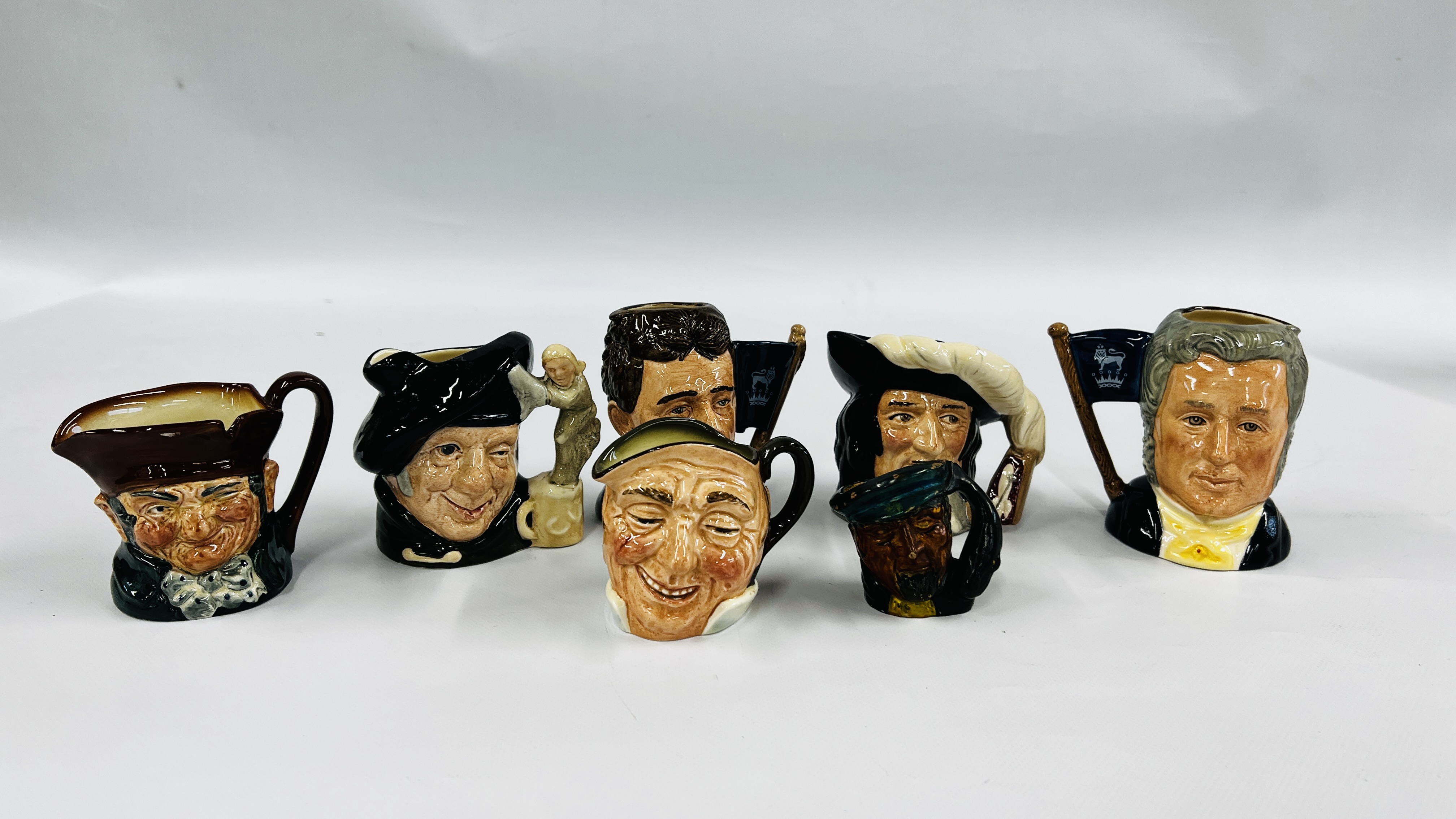 A GROUP OF SEVEN ROYAL DOULTON CHARACTER JUGS TO INCLUDE MICHAEL DOULTON D6808, TAM O'SHANTER D6636,