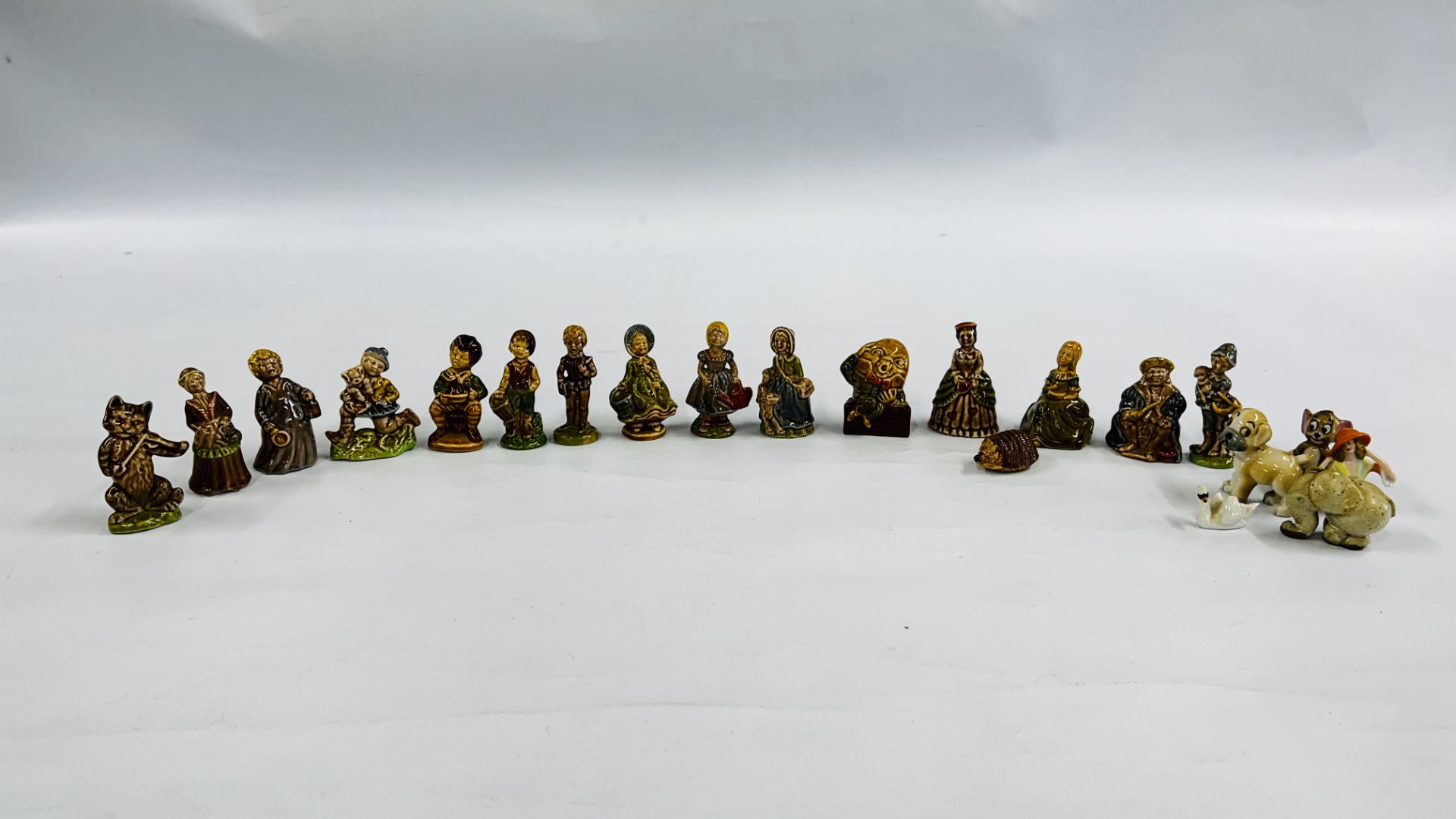 A GROUP OF WADE WHIMSIES TO INCLUDE NURSERY RHYME EXAMPLES SUCH AS HUMPTY DUMPTY, ETC.