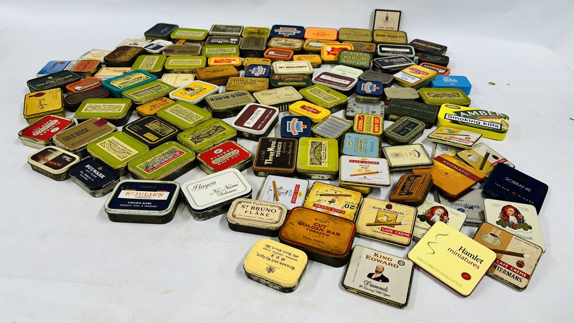 A BOX CONTAINING AN EXTENSIVE COLLECTION OF ASSORTED EMPTY VINTAGE TOBACCO TINS TO INCLUDE EXAMPLES