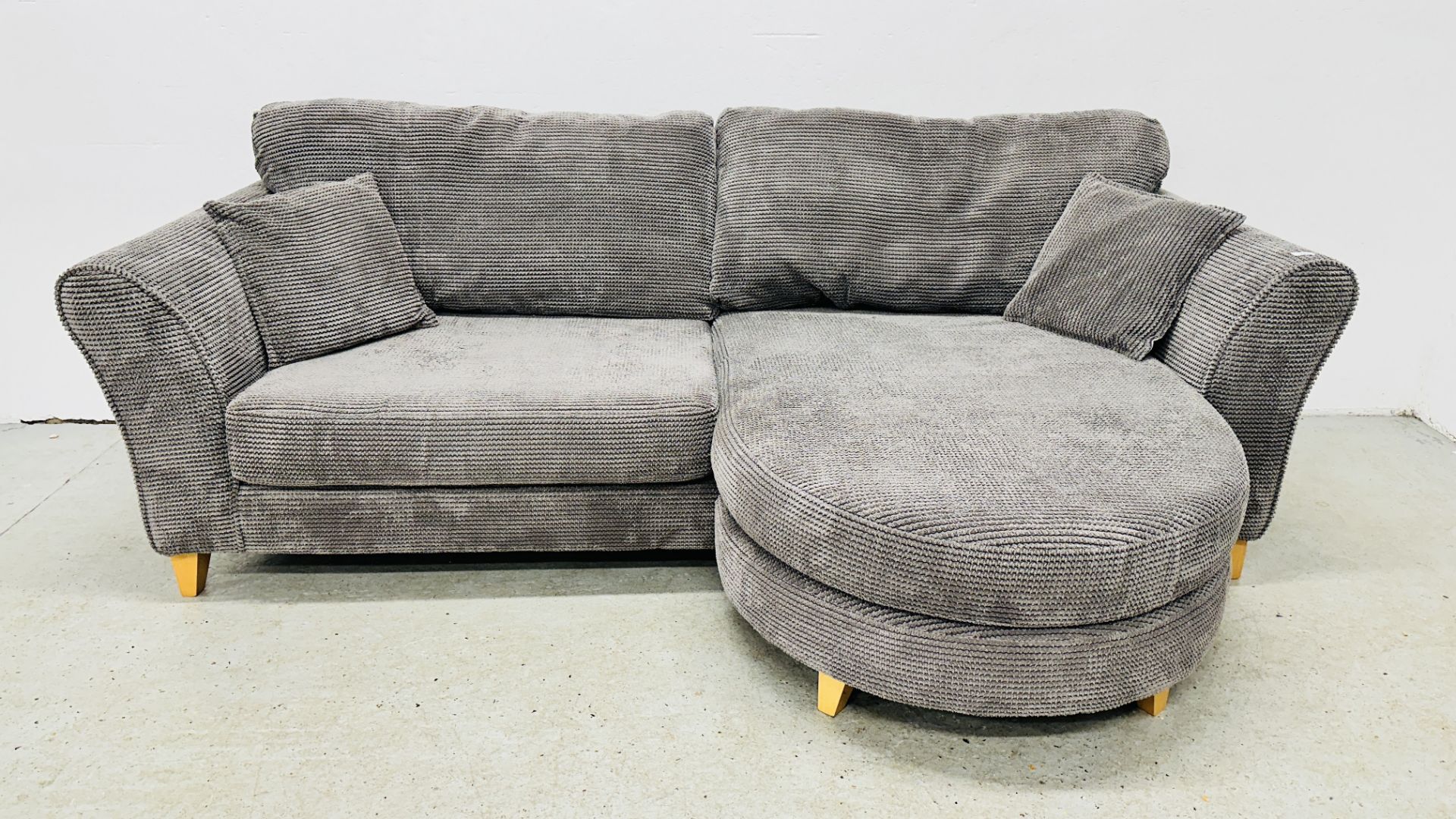 GOOD QUALITY DFS CORNER SOFA UPHOLSTERED IN CHARCOAL GREY.