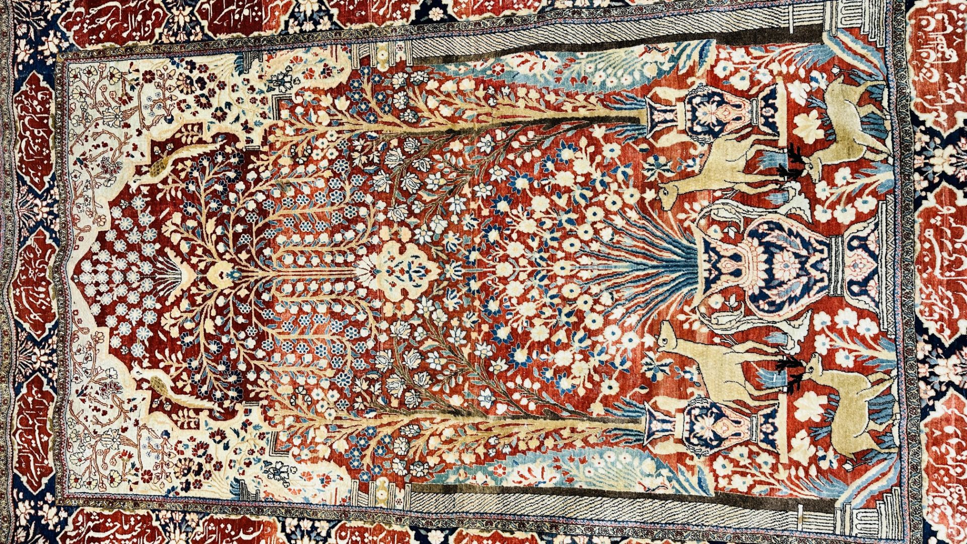 A PERSIAN DESIGN RUG DECORATED WITH SPRAYS OF FLOWERS AND DEER AND ARABIC INSCRIPTIONS, - Image 5 of 32