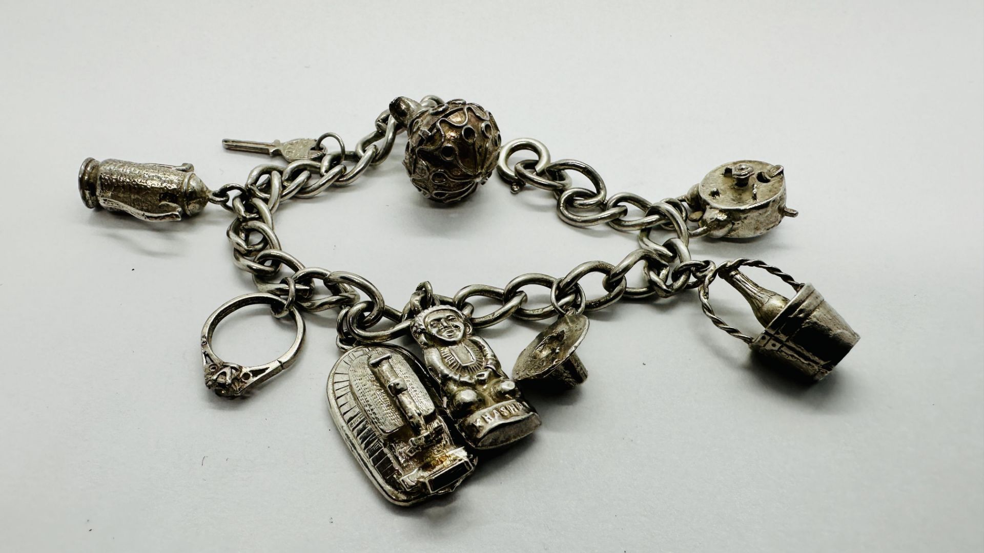 VINTAGE SILVER 925 CHARM BRACELET - 9 CHARMS ATTACHED.