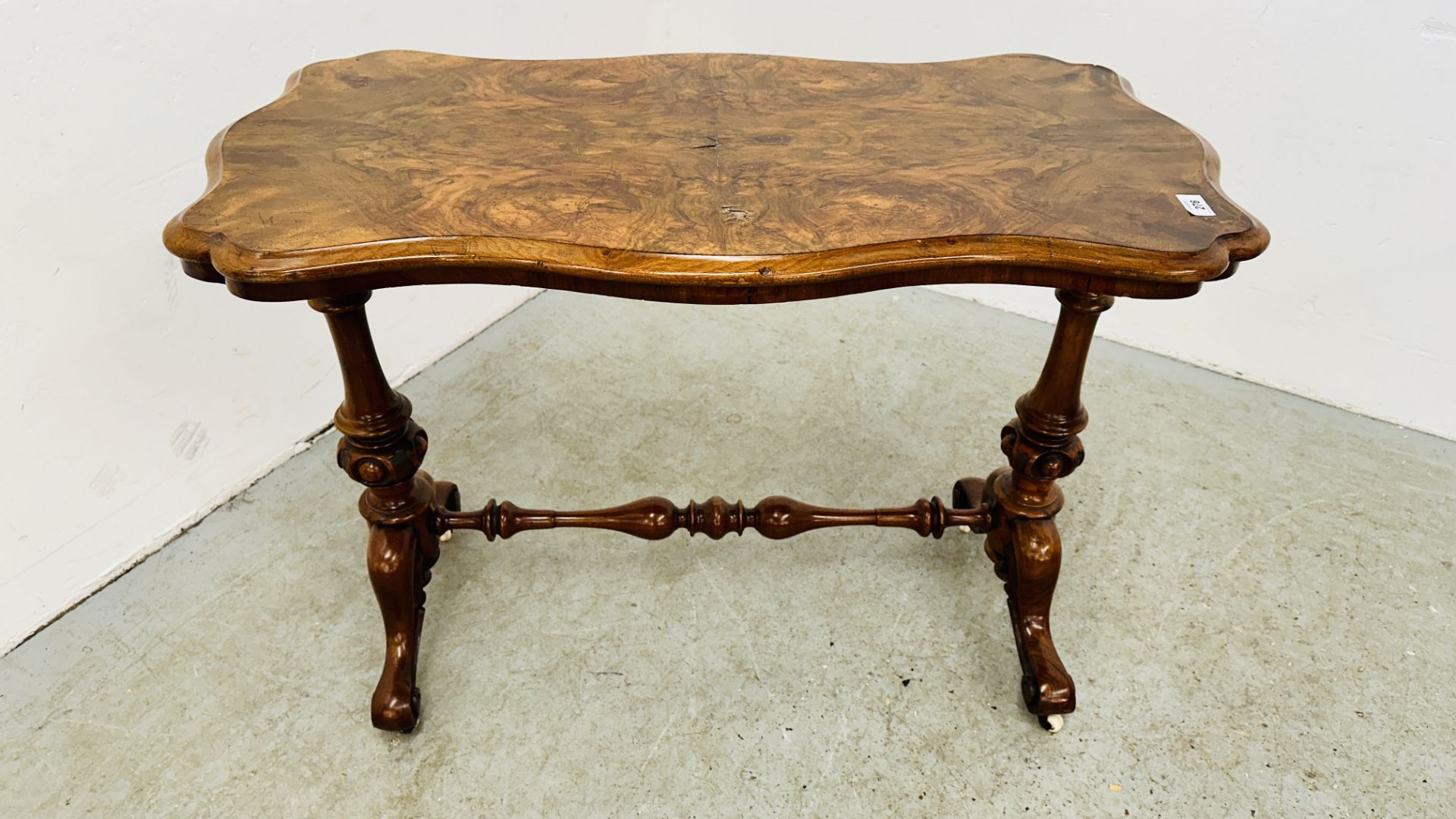 A VICTORIAN OCCASIONAL TABLE ON CASTERS W 96CM X D 50CM.