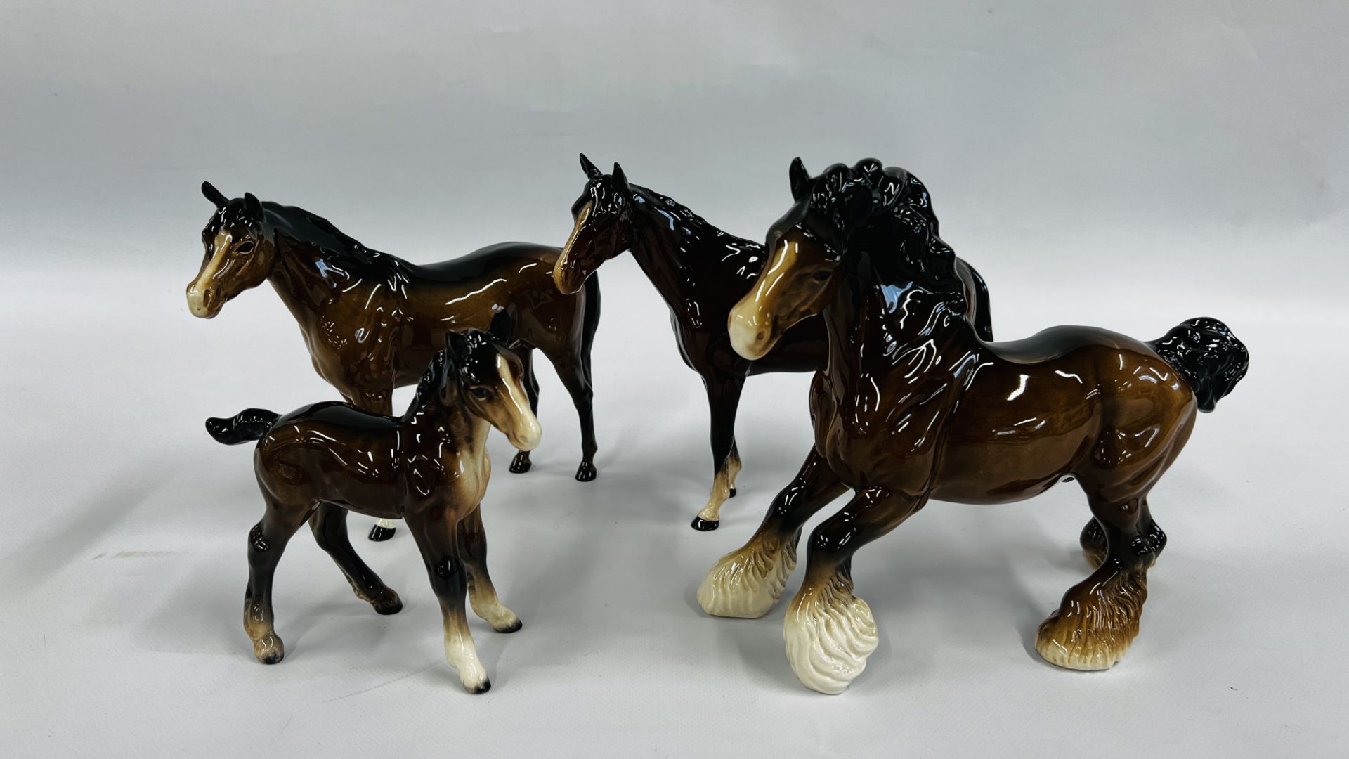 THREE BESWICK CHESTNUT HORSE ORNAMENTS AND FOAL.