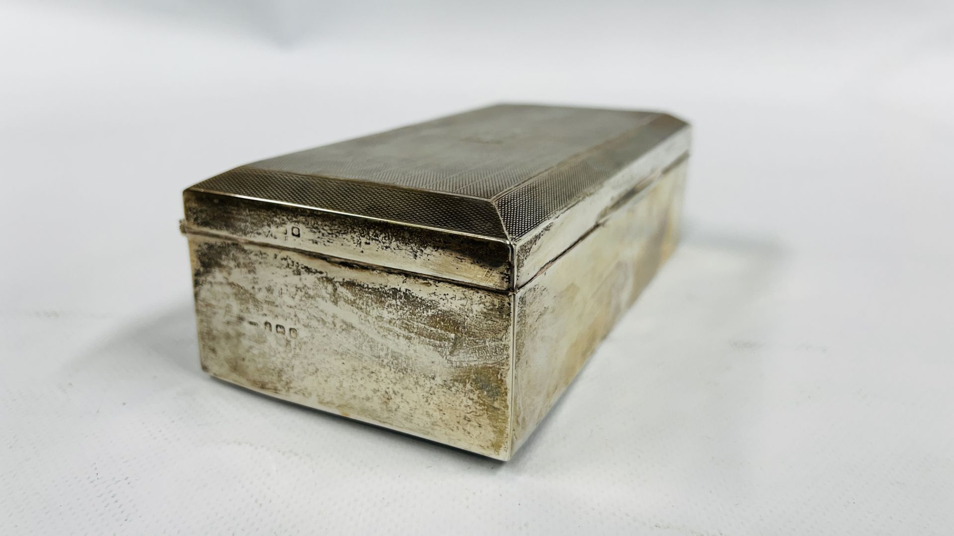 A VINTAGE SILVER CIGARETTE BOX BIRMINGHAM ASSAY J.H.W (RUBBED MARKS) BEARING MONOGRAM MJ 24.7. - Image 5 of 10