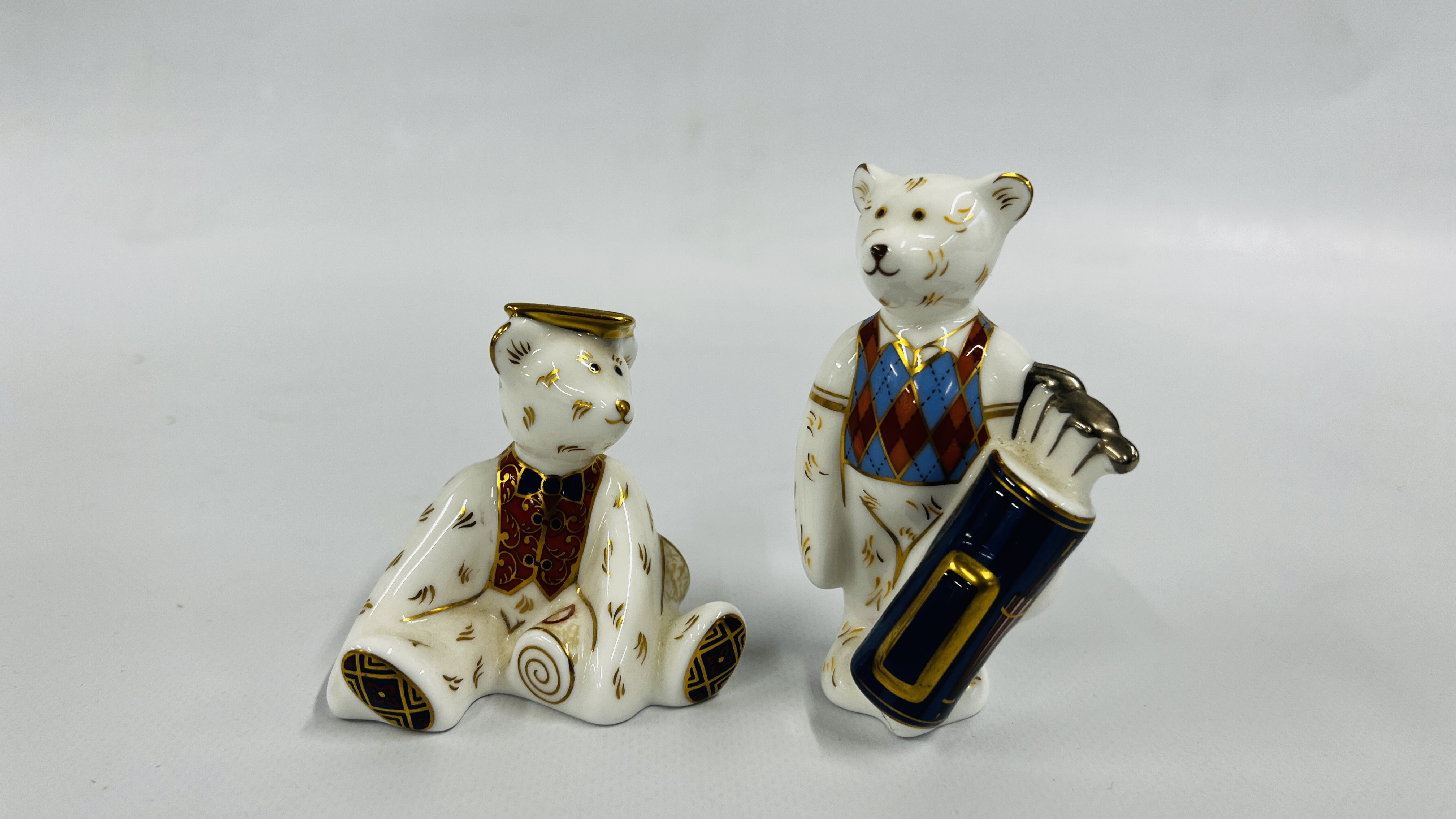 2 ROYAL CROWN DERBY FIGURES TO INCLUDE "GRADUATE" H 7CM AND GOLFER BEAR H 9CM NO STOPPERS.