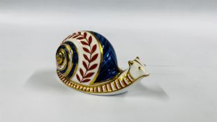 A ROYAL CROWN DERBY "SNAIL" PAPERWEIGHT.