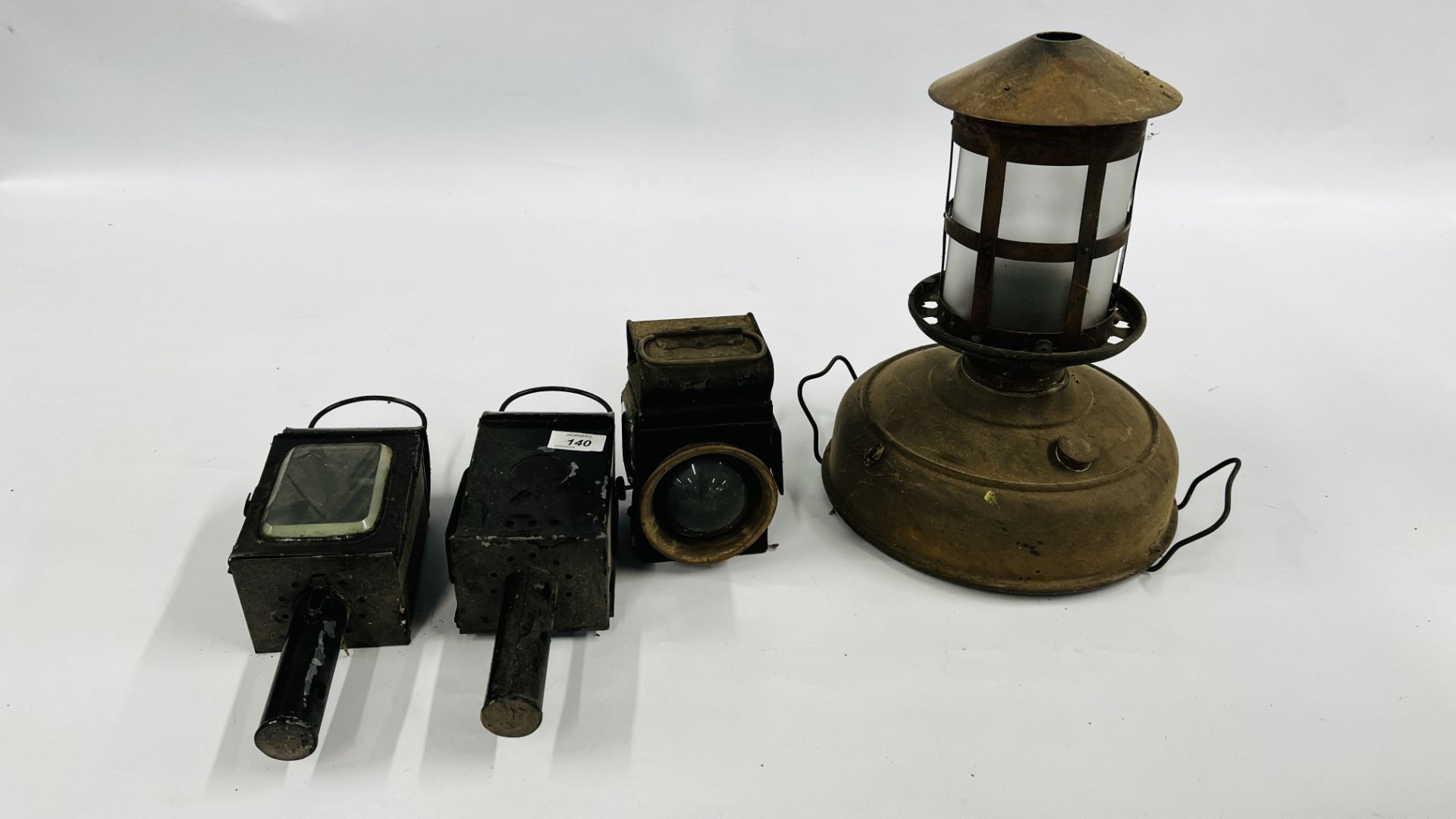 GROUP OF ANTIQUE LANTERNS INCLUDING BICYCLE LANTERN AND PARAFFIN LANTERN.