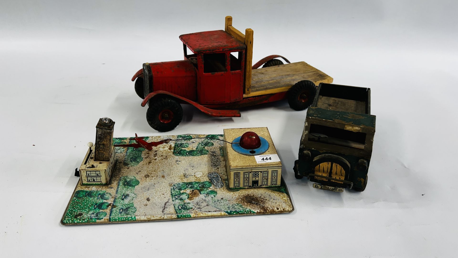 3 VINTAGE TIN TOYS TO INCLUDE ROTARY FLYING PLANE & 2 TOY TRUCKS.