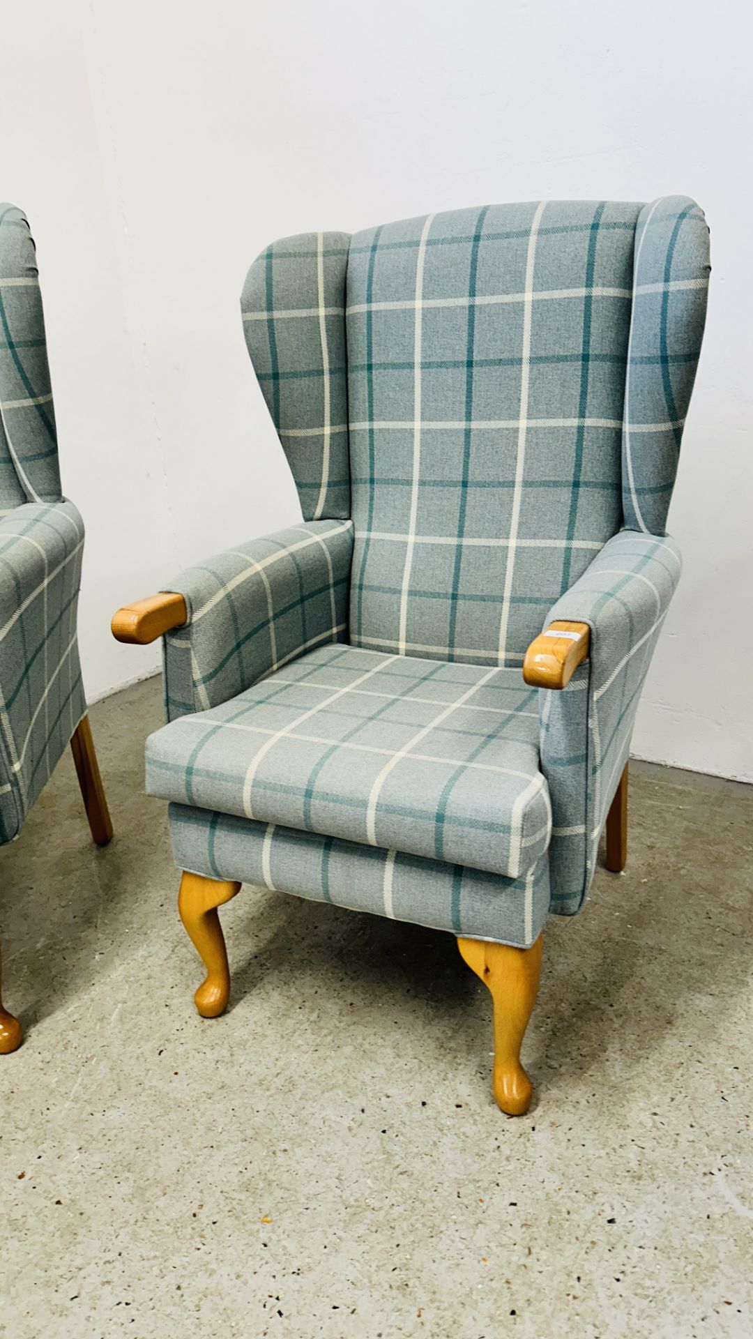 A HIS & HERS SET OF MODERN BLUE CHECKERED UPHOLSTERED BEECH WOOD WING BACK CHAIRS. - Image 2 of 17