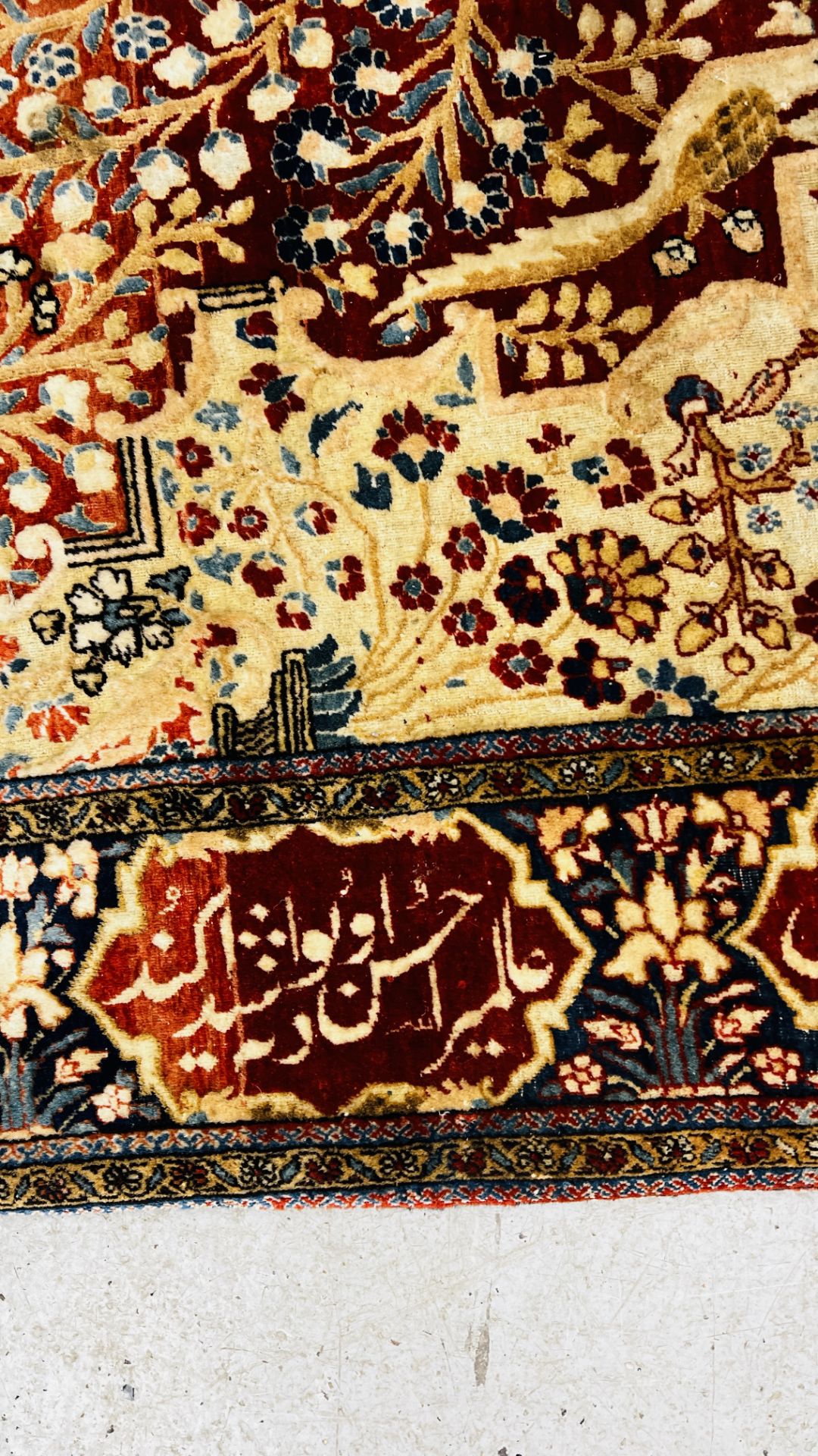 A PERSIAN DESIGN RUG DECORATED WITH SPRAYS OF FLOWERS AND DEER AND ARABIC INSCRIPTIONS, - Image 12 of 32