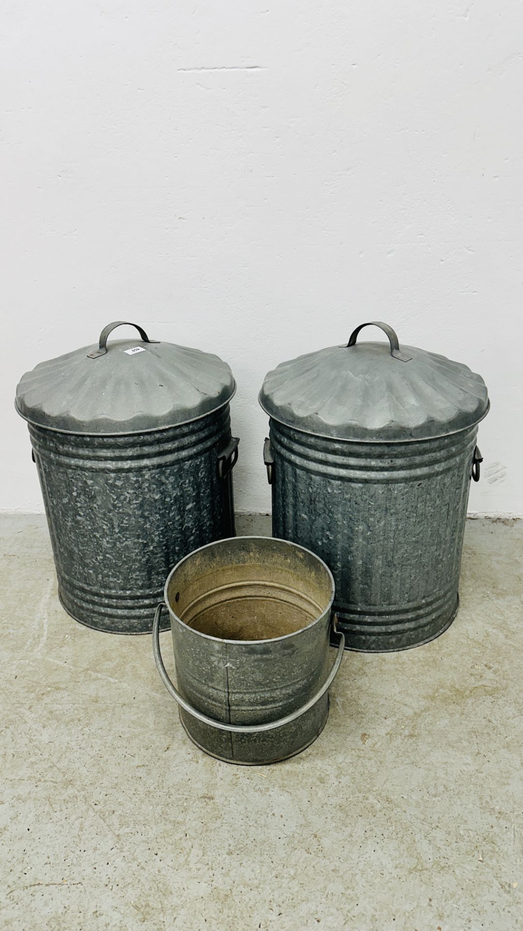 TWO GALVANISED DUSTBINS WITH LIDS AND GALVANISED PALE.