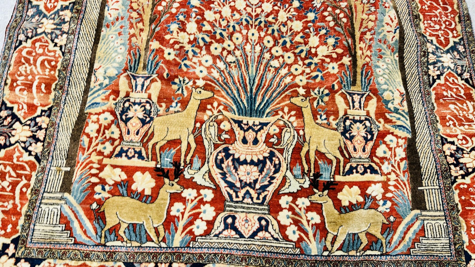 A PERSIAN DESIGN RUG DECORATED WITH SPRAYS OF FLOWERS AND DEER AND ARABIC INSCRIPTIONS, - Image 6 of 32