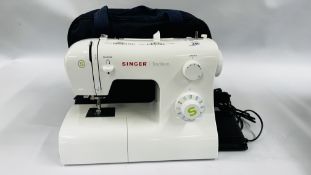A SINGER TRADITION ELECTRIC SEWING MACHINE MODEL 2273 WITH COVER, CASE,