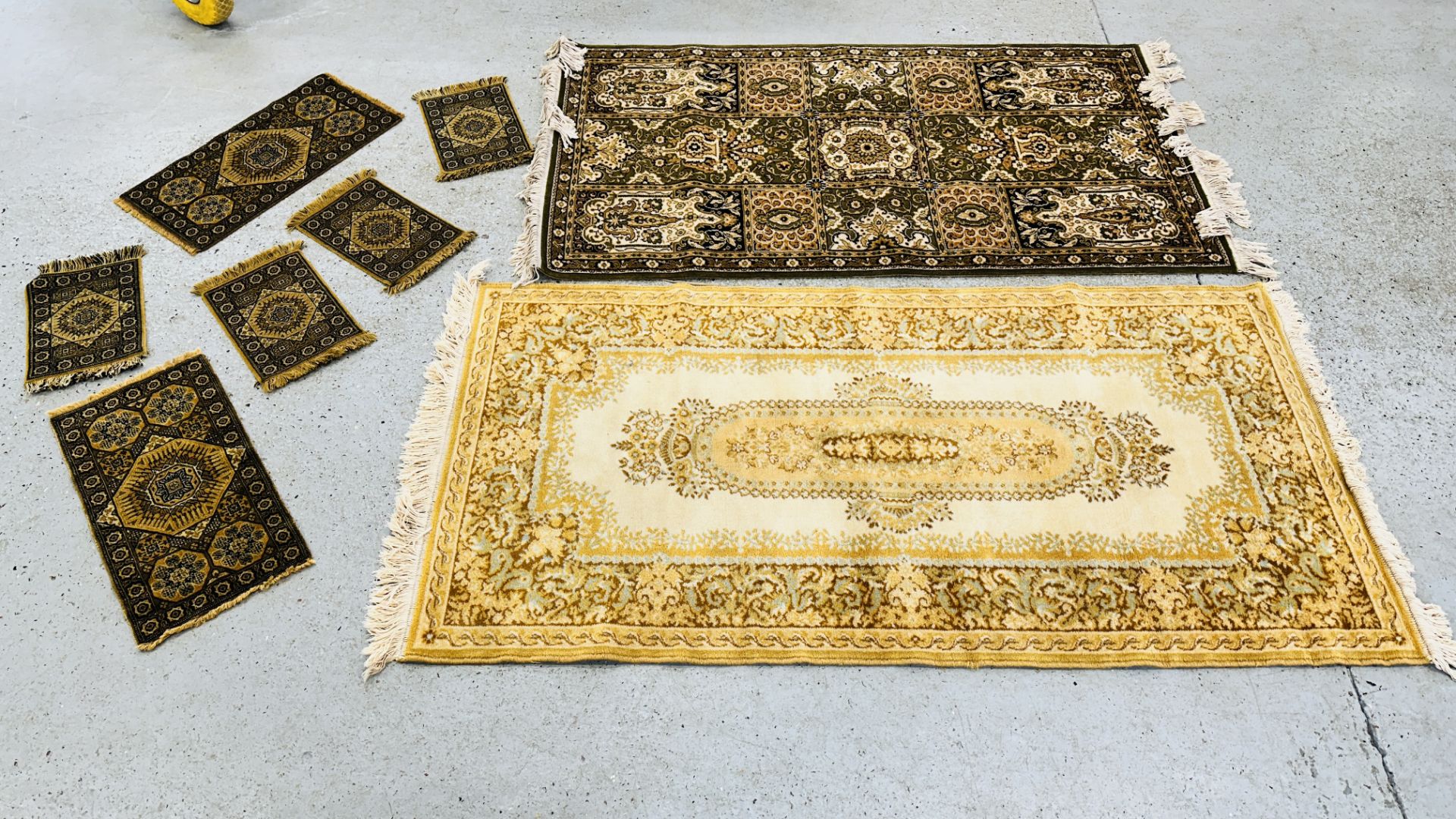 TWO MODERN MACHINE MADE EASTERN DESIGN RUGS ALONG WITH A GROUP OF SMALL EASTERN DESIGN RUGS.