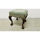 ANTIQUE DRESSING STOOL WITH GREEN UPHOLSTERED SEAT, THE LEGS TERMINATING WITH BALL AND CLAW DETAIL.