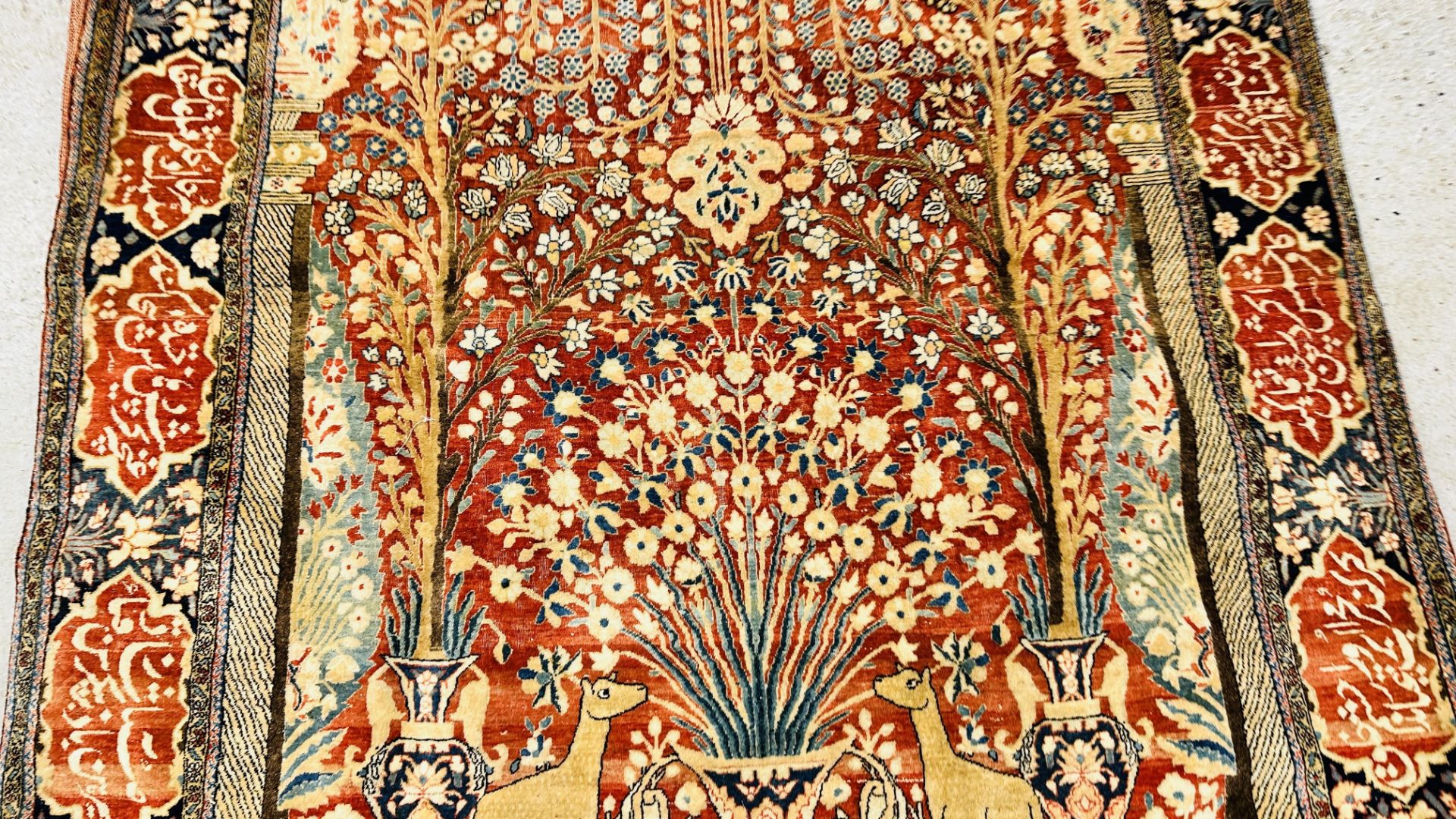 A PERSIAN DESIGN RUG DECORATED WITH SPRAYS OF FLOWERS AND DEER AND ARABIC INSCRIPTIONS, - Image 3 of 32