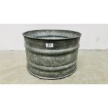 A GALVANISED SHALLOW RIBBED BUCKET.