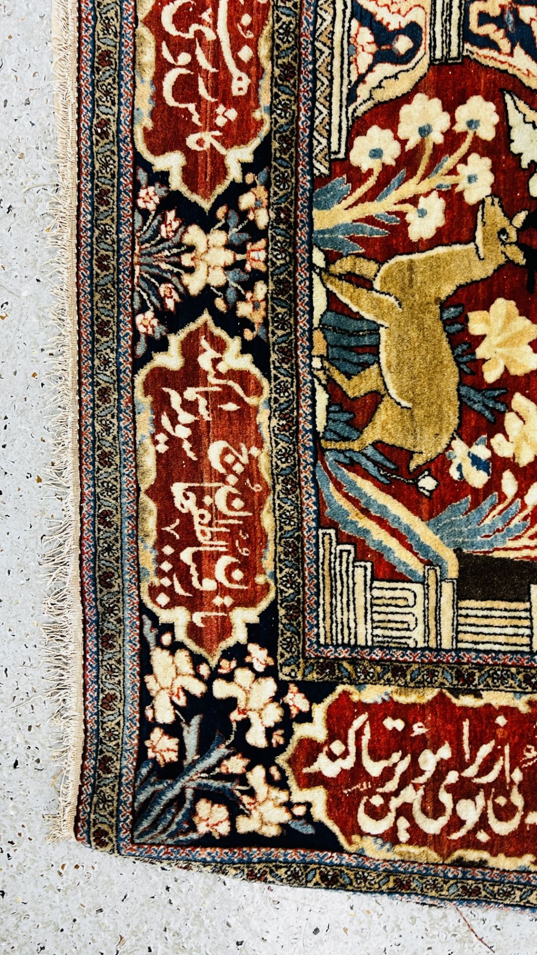 A PERSIAN DESIGN RUG DECORATED WITH SPRAYS OF FLOWERS AND DEER AND ARABIC INSCRIPTIONS, - Image 24 of 32