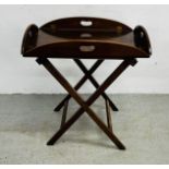 A MAHOGANY BUTLER'S TRAY WITH FOLDING SIDES ON FOLDING STAND TRAY 68 X 42CM.